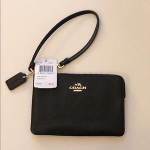 Brand new Coach leather wristlet